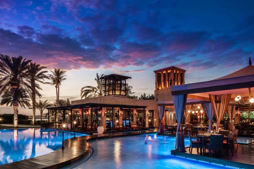 Sunset view of poolside restaurant at One&Only Royal Mirage, Dubai.