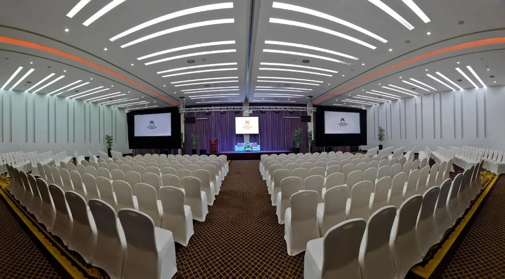Conference hall at Two Seasons Hotel, Dubai, with rows of chairs.