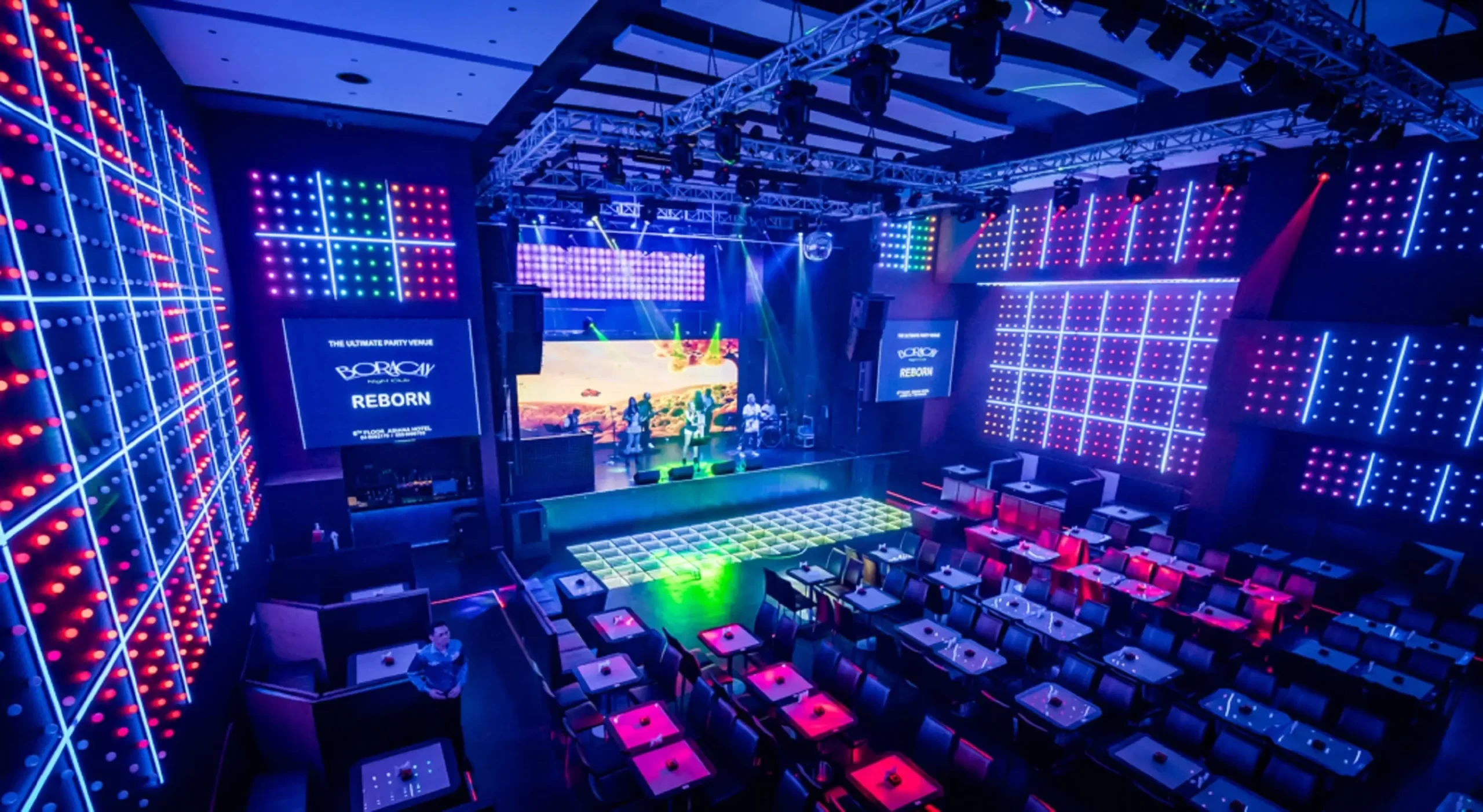 Colorful interior of Boracay Night Club, Dubai with stage and seating.