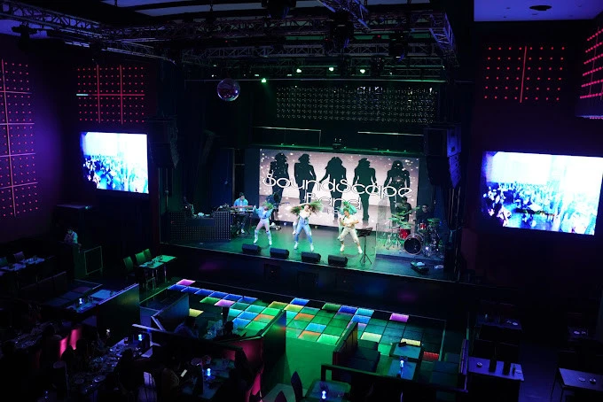 Boracay Night Club stage with performers and colorful lights in Dubai.