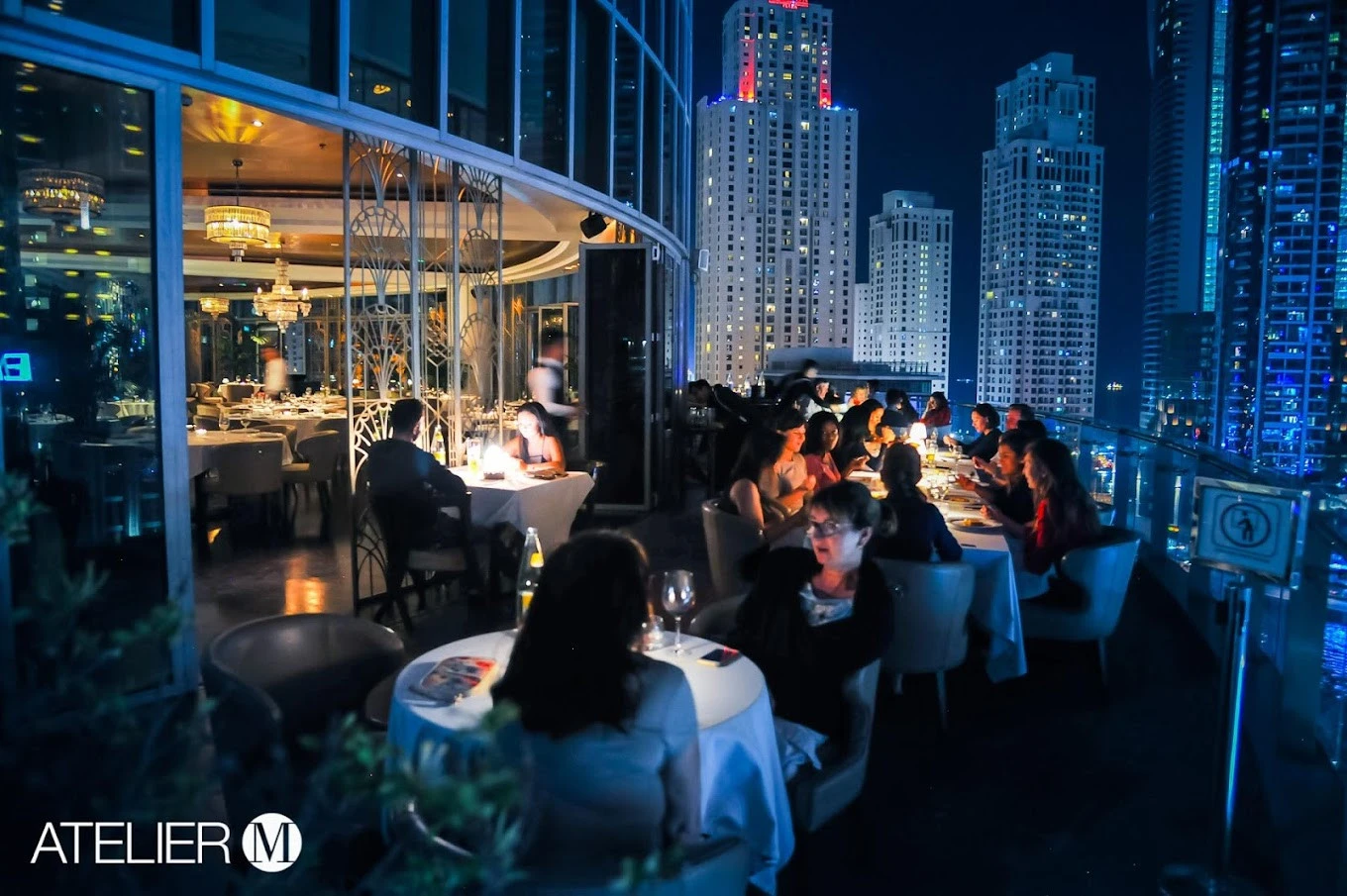 Atelier M rooftop dining with city skyline, Dubai.