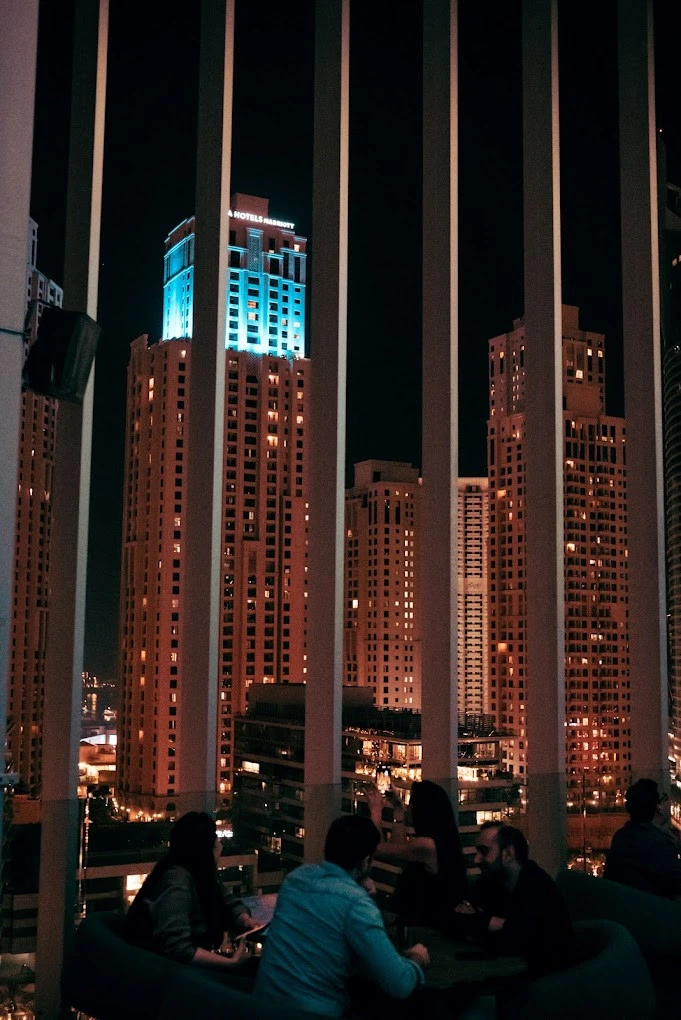 Night view from Atelier M, Dubai, with illuminated skyscrapers.