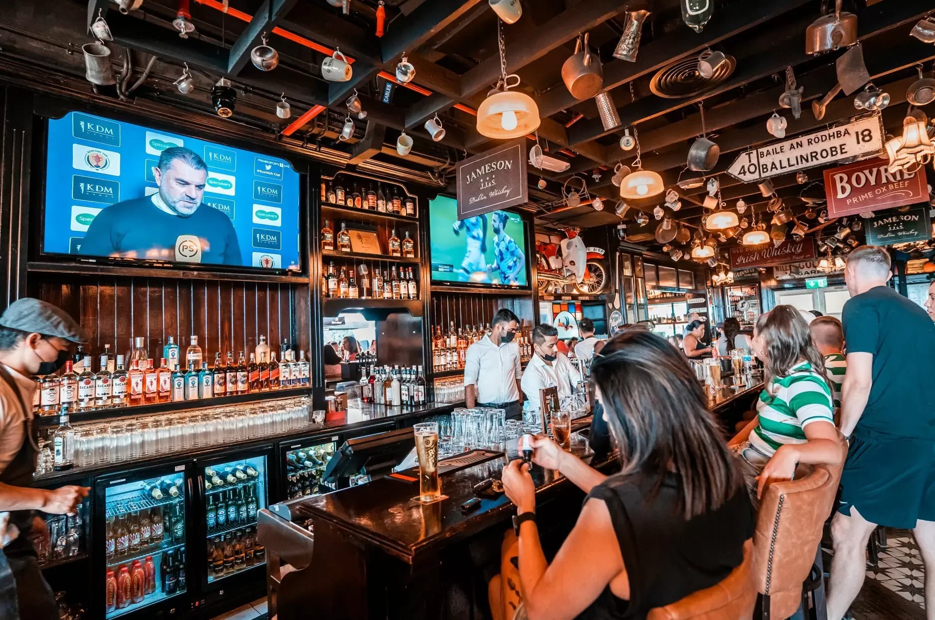 Busy bar scene at McCafferty's Pub Jumeirah Village, Dubai.
