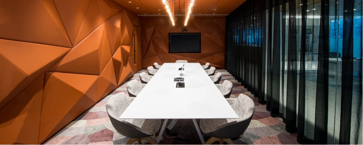 Modern meeting room at D3 Dubai Design District with geometric walls.