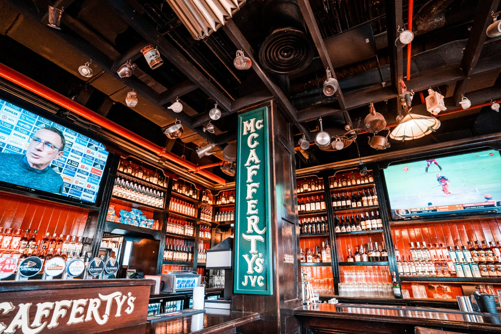 Interior of McCafferty's Pub Jumeirah Village, Dubai with sports screens.