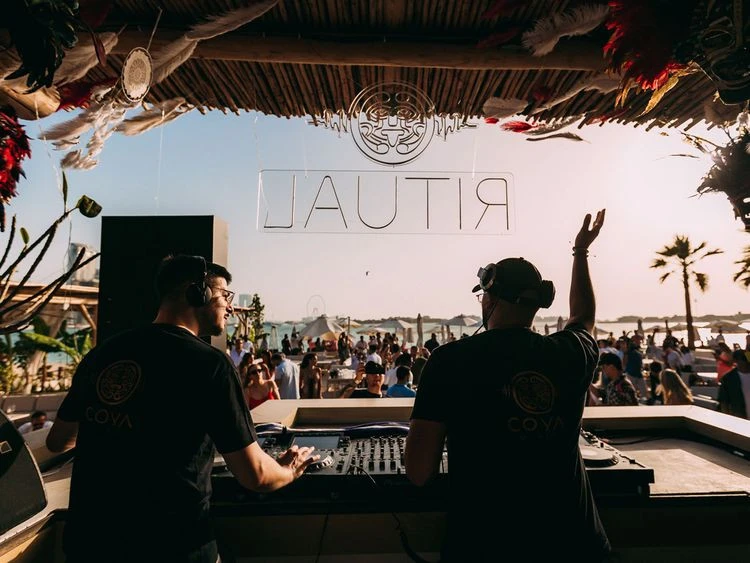 DJs performing at Surf Club Dubai beach party.