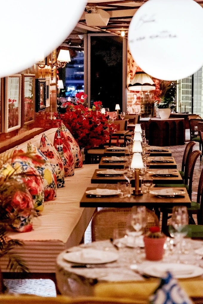 Elegant dining setup at Papas Dubai Marina with floral decor.