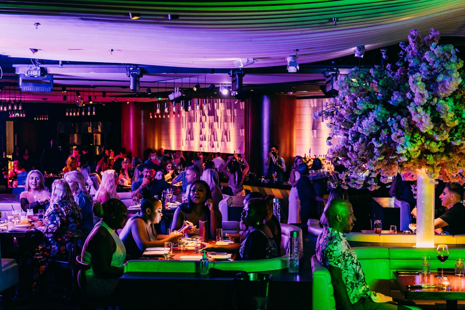 Vibrant dining scene at STK Dubai JBR, lively atmosphere.