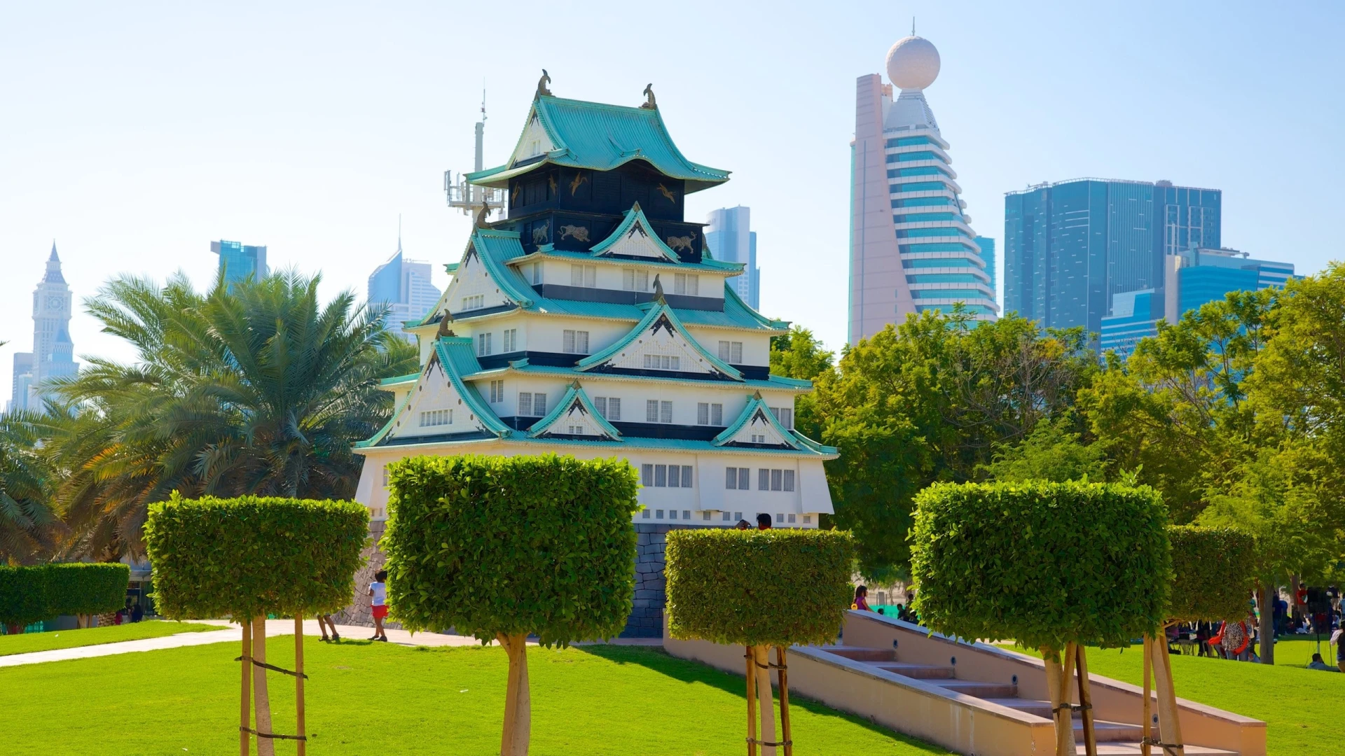 Japanese-style building in Zabeel Park, Dubai, with skyscrapers in background.