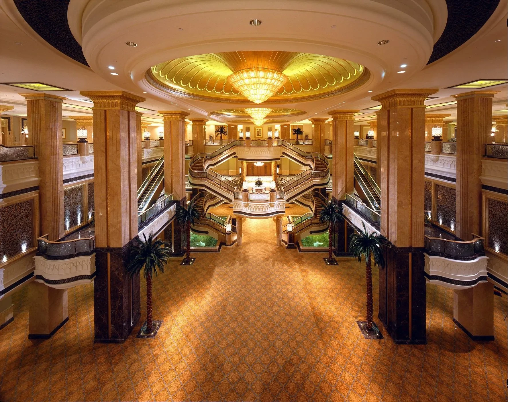 Luxurious Emirates Palace lobby with grand staircase, Abu Dhabi.