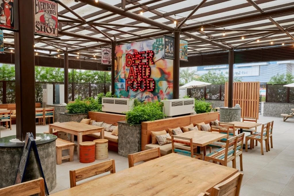 Citymax Hotel Business Bay patio with colorful mural, Dubai.