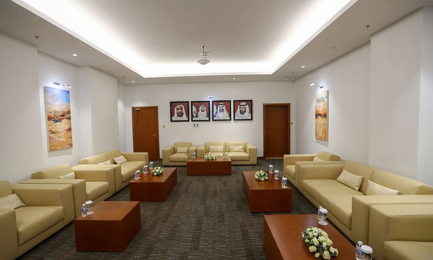 Elegant lounge with beige sofas at ADNEC Centre Abu Dhabi.