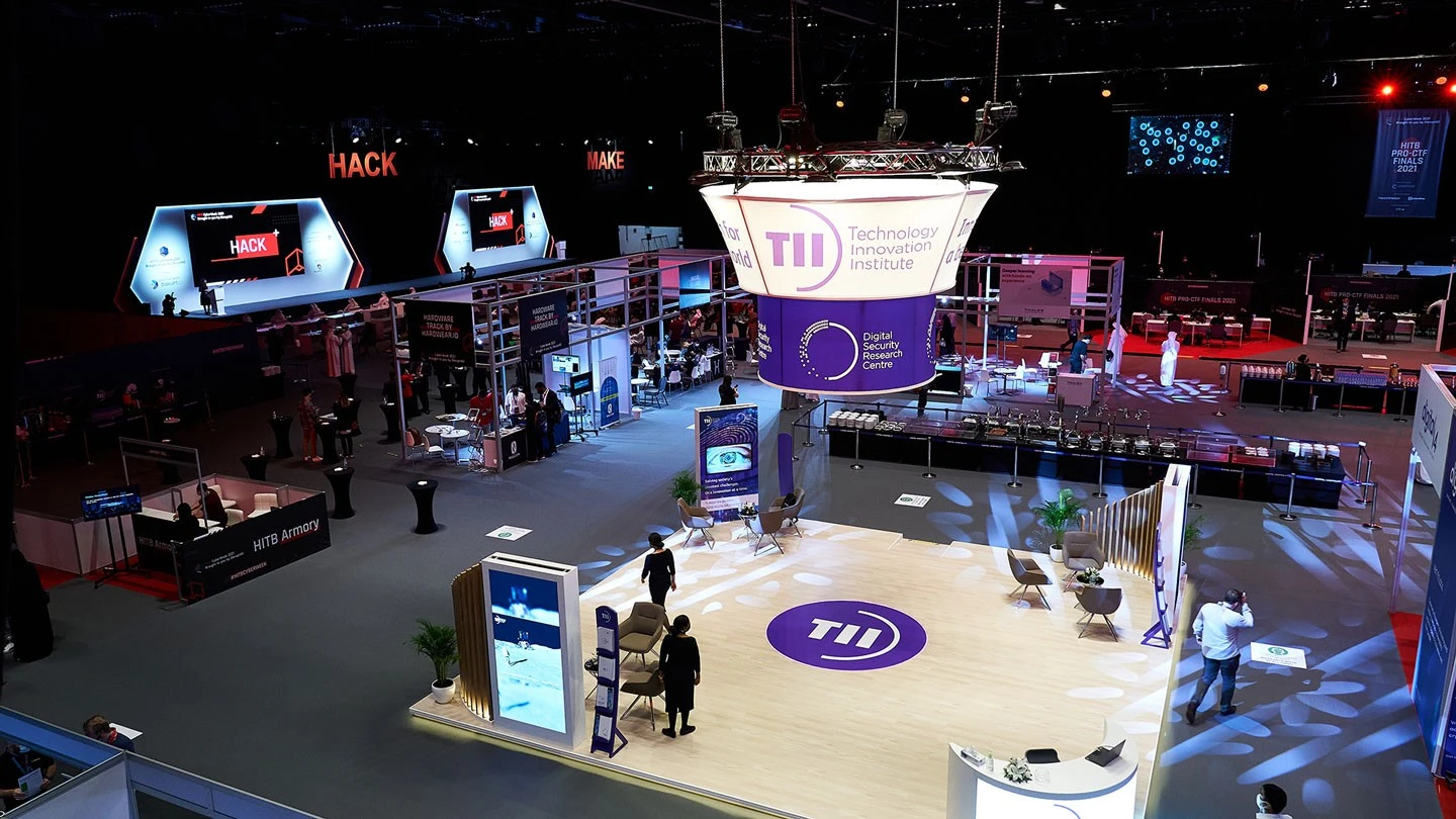 ADNEC Centre Abu Dhabi event space with technology exhibits and attendees.