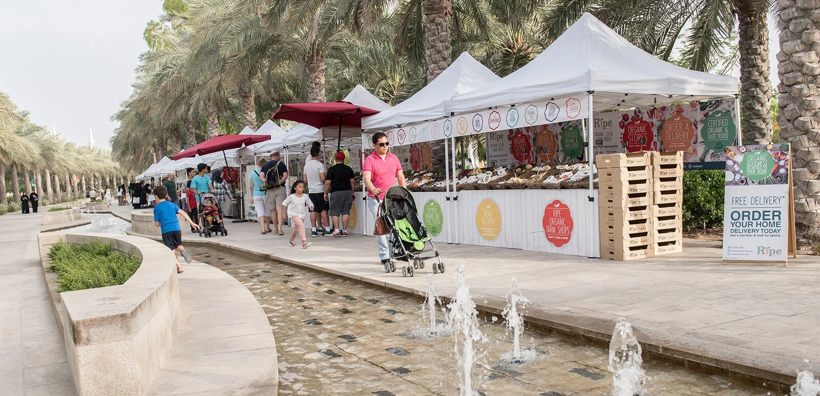 Market stalls along promenade at Umm Al Emarat Park, Abu Dhabi.