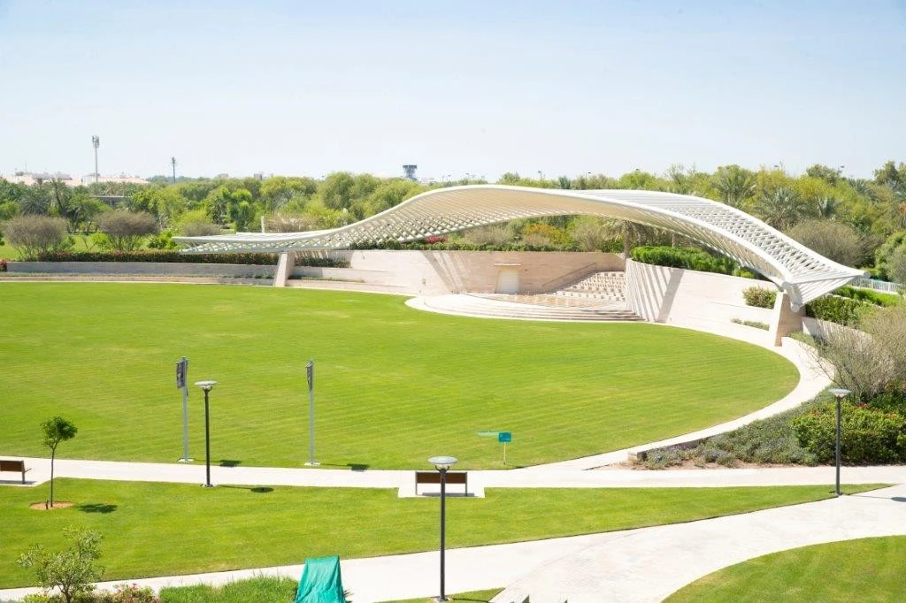 Umm Al Emarat Park amphitheater with green lawn, Abu Dhabi.