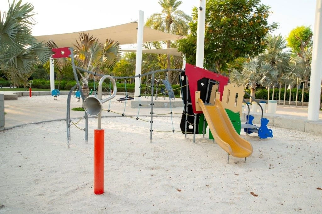 Children's playground with slide at Umm Al Emarat Park, Abu Dhabi.