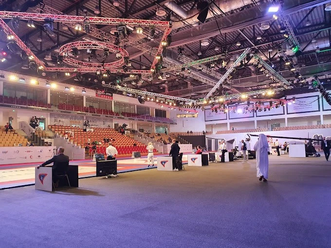 Mubadala Arena with illuminated ceiling and event preparation, Abu Dhabi.