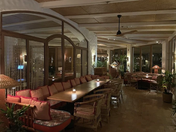 Cozy dining area at Tagomago Dubai with warm lighting.