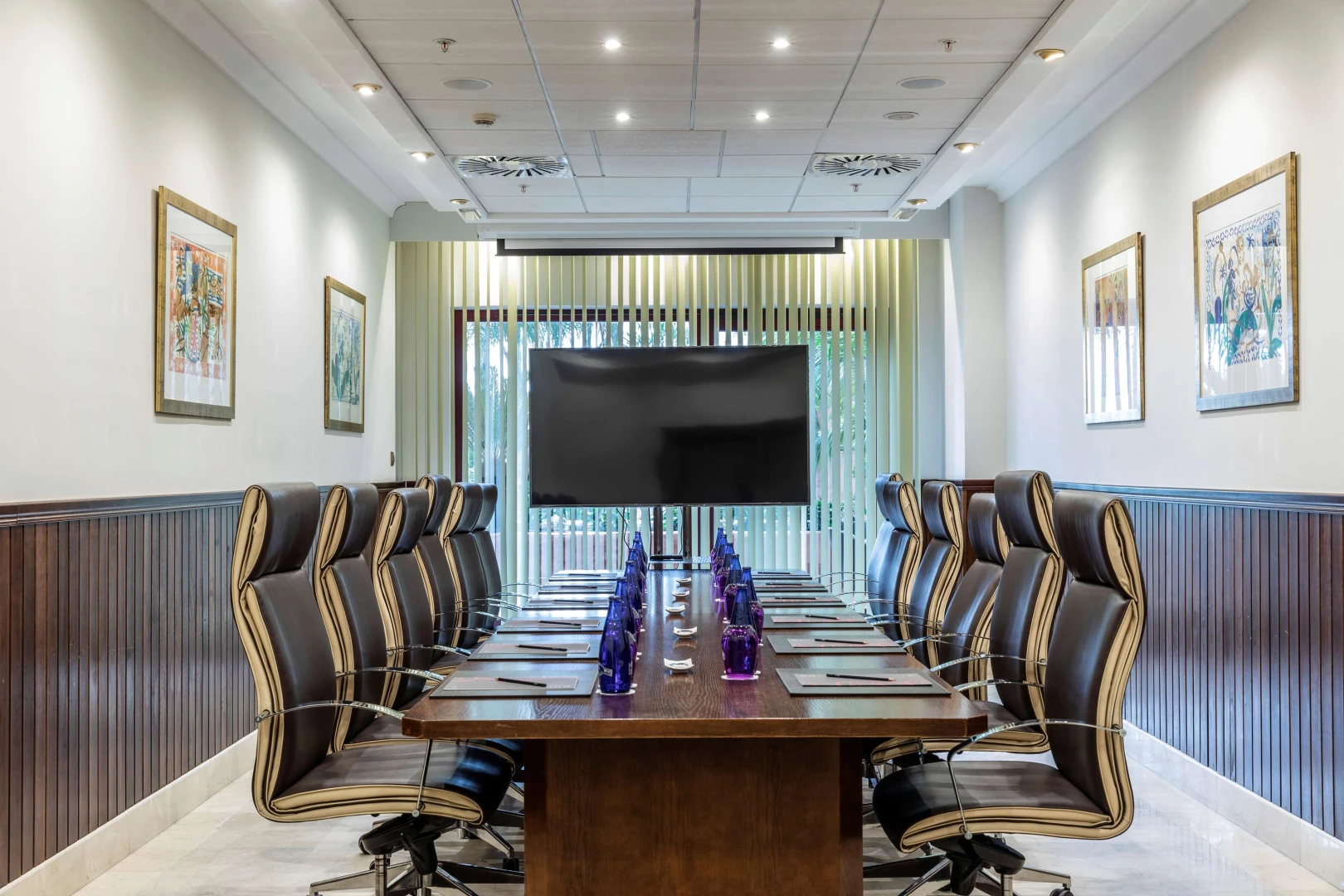 Boardroom with chairs and screen, Kempinski Hotel Ajman.