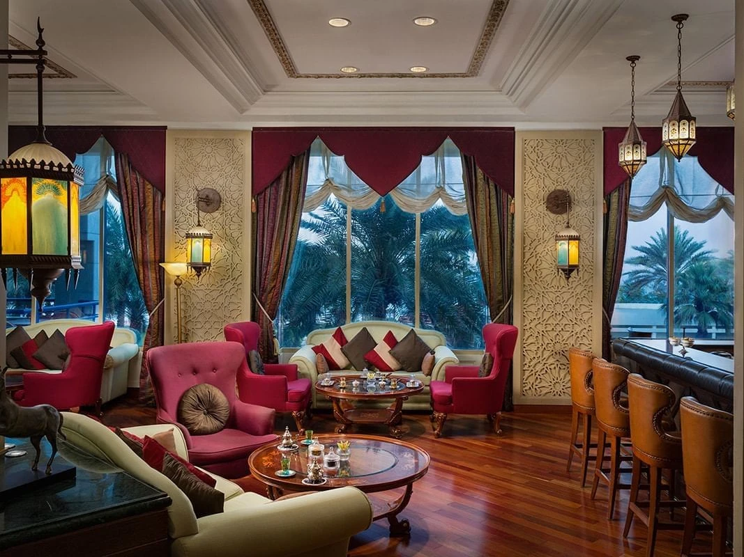 Elegant lounge at Kempinski Hotel Ajman with colorful seating.
