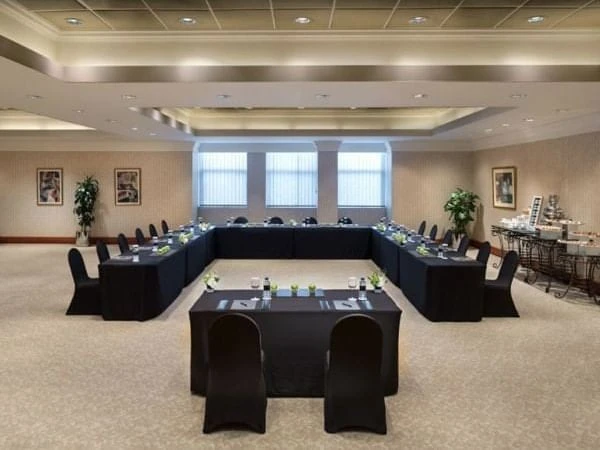 Elegant conference room at Kempinski Hotel Ajman with U-shaped table setup.