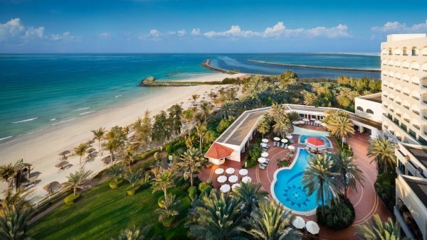 Kempinski Hotel Ajman outdoor pool area overlooking the beach.