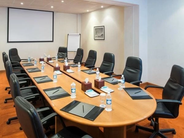 Conference room at Kempinski Hotel Ajman with boardroom setup.