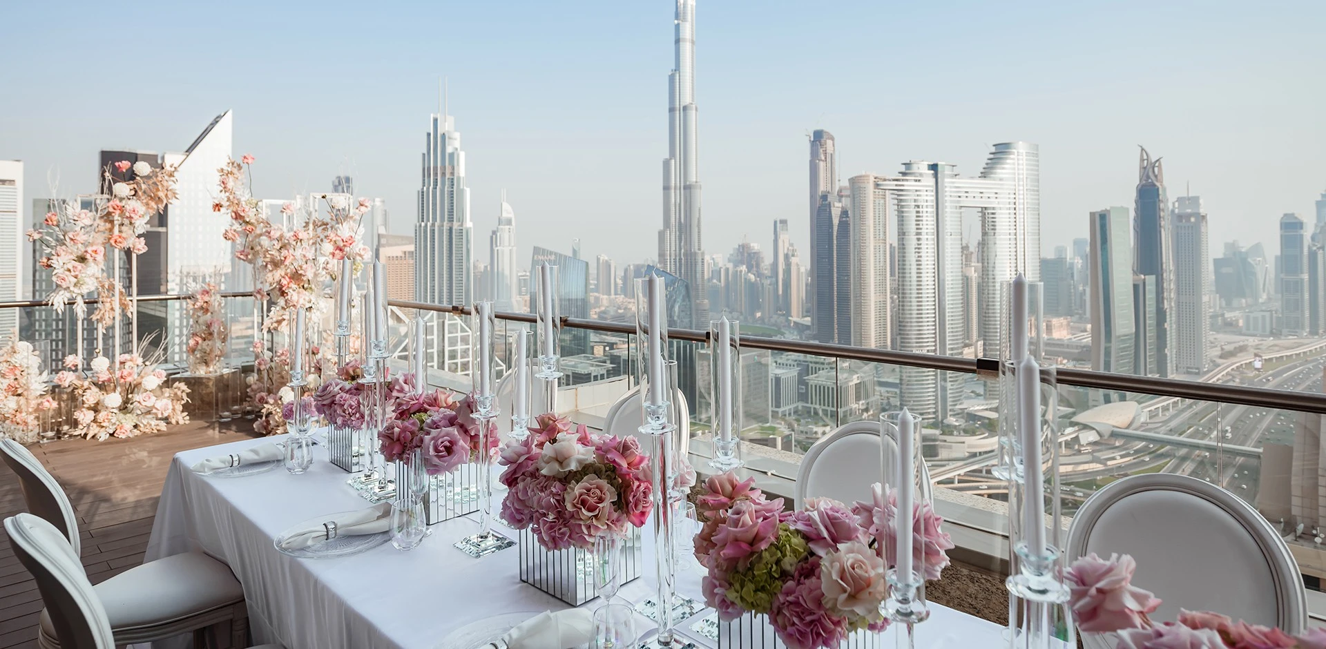 Elegant wedding setup at Shangri-La Dubai with city skyline view.