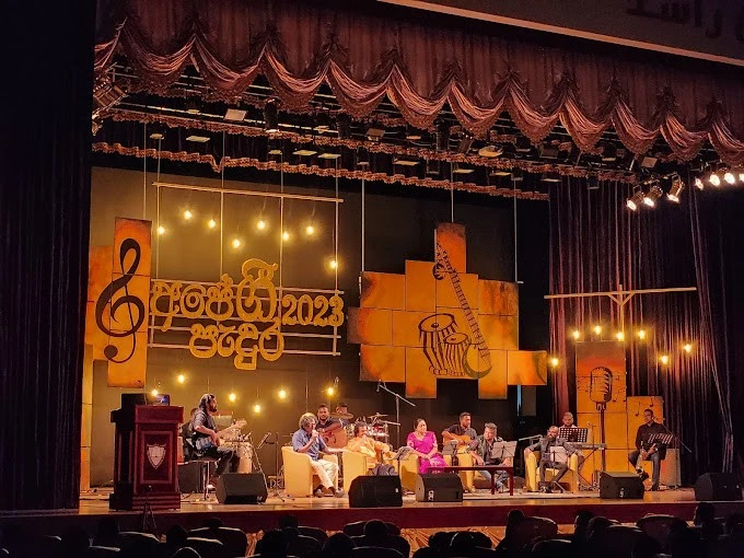 Musicians performing on stage at Sheikh Rashid Auditorium, Dubai.
