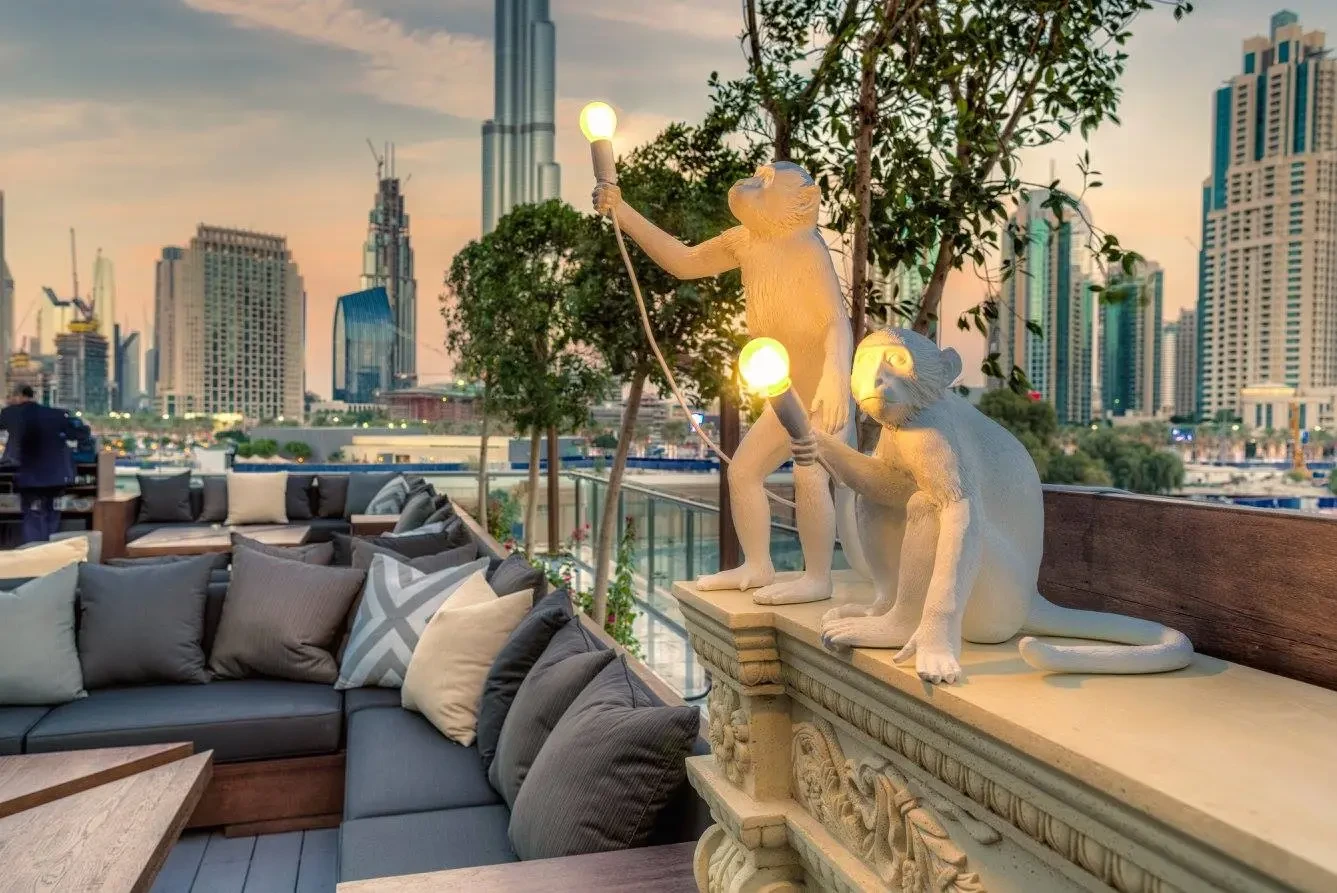 Treehouse lounge with monkey lamps, Dubai skyline view, Taj Dubai.