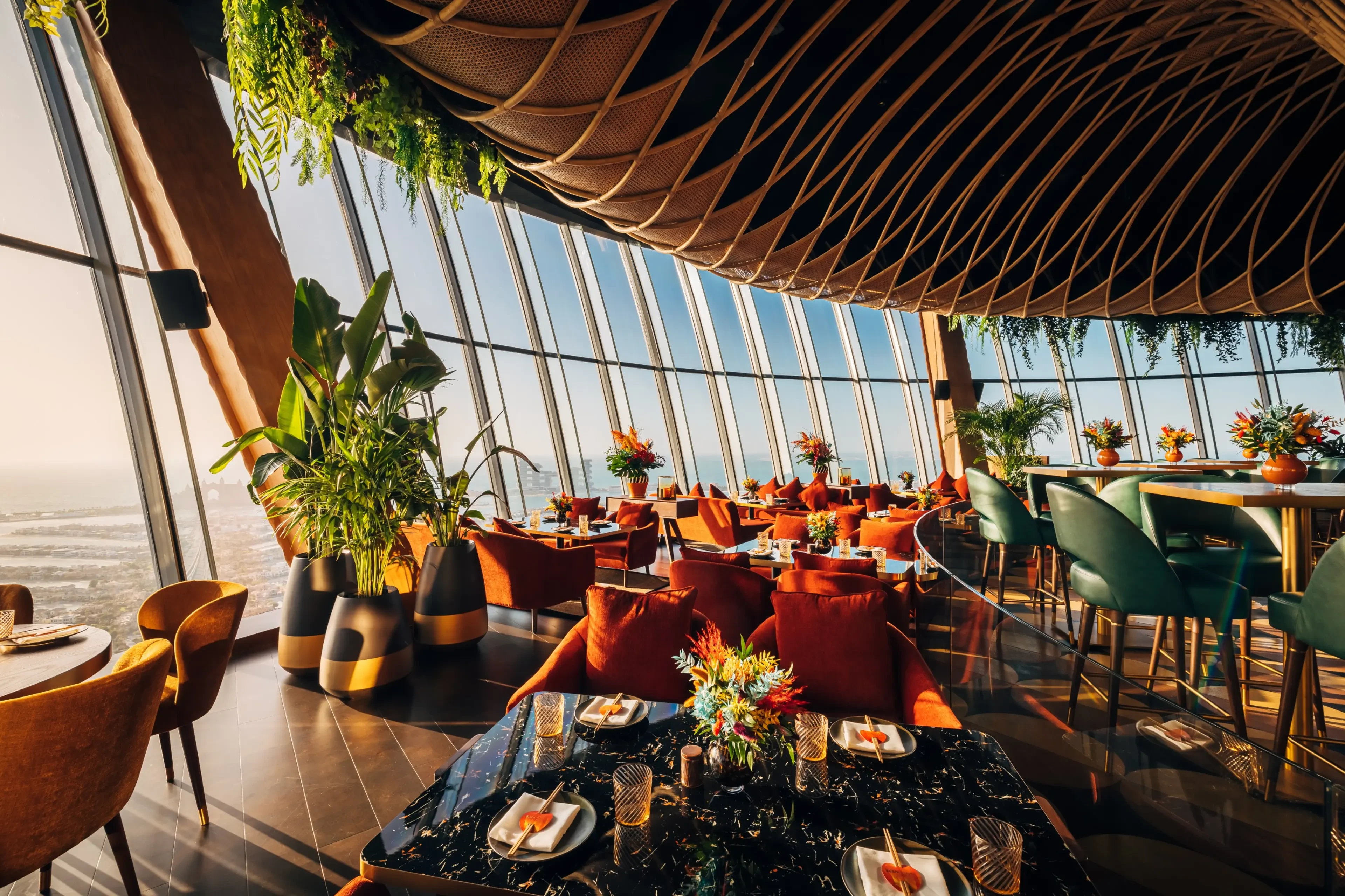 Sushisamba Dubai interior with panoramic windows and vibrant decor.