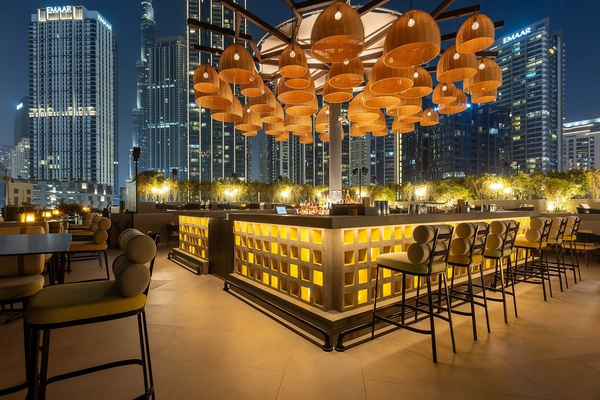 Stylish rooftop bar with illuminated seating, Treehouse, Taj Dubai.