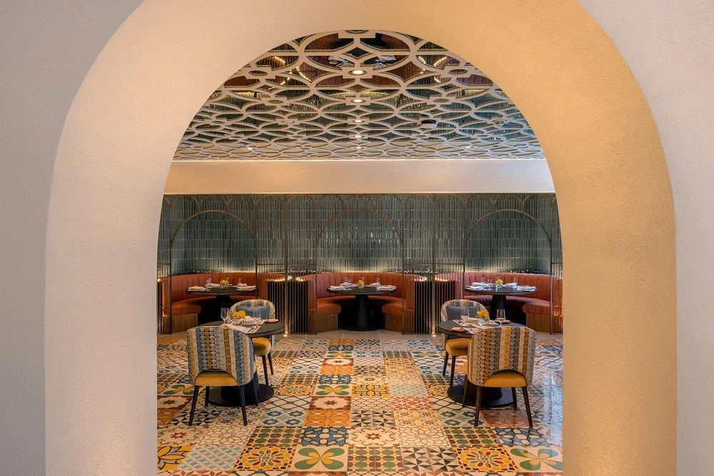 Colorful interior of La Sirene Restaurant Dubai with patterned tiles.