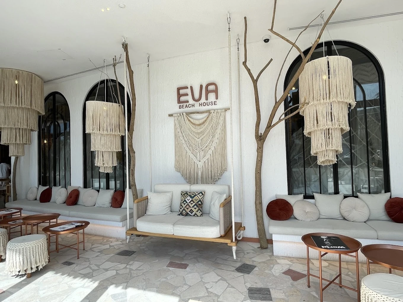 EVA Beach Restaurant lounge area with bohemian decor, Dubai.