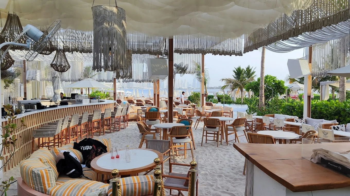 EVA Beach Restaurant outdoor seating with ocean view, Dubai.