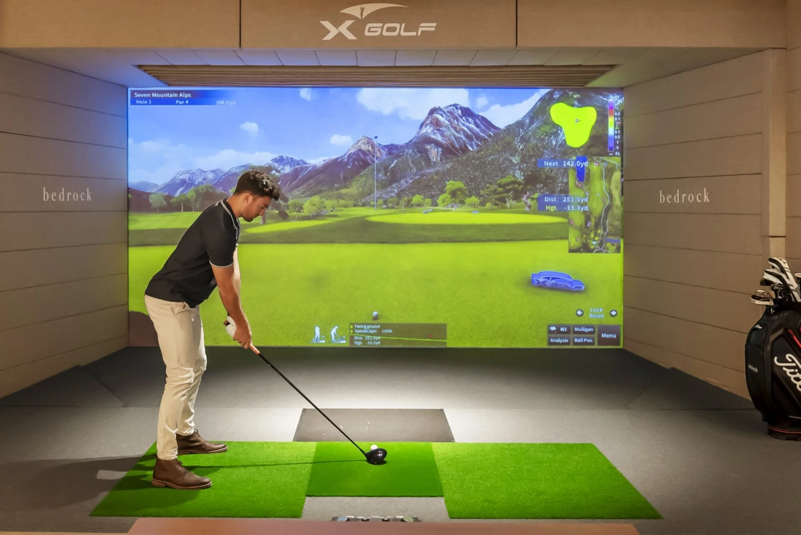 Man playing virtual golf at Bedrock Pier 7, Dubai.