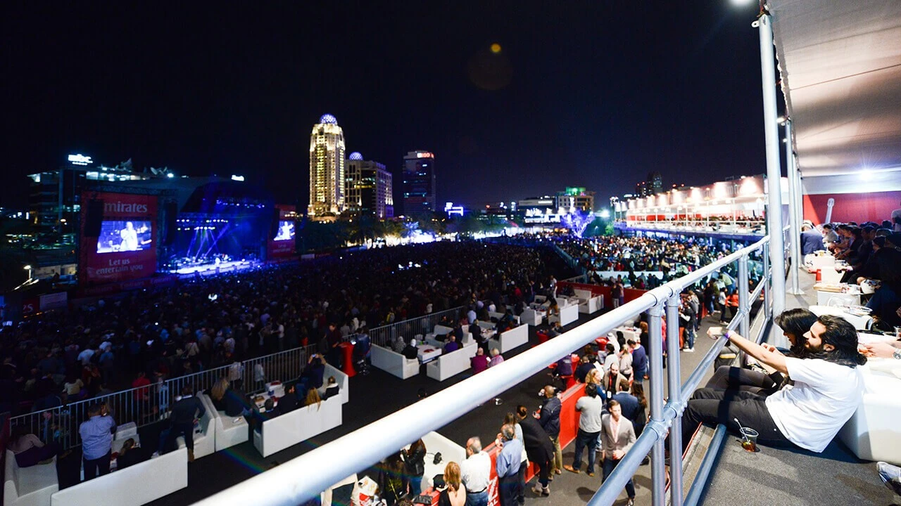 Crowd enjoying night event at Dubai Media City Amphitheatre, Dubai.