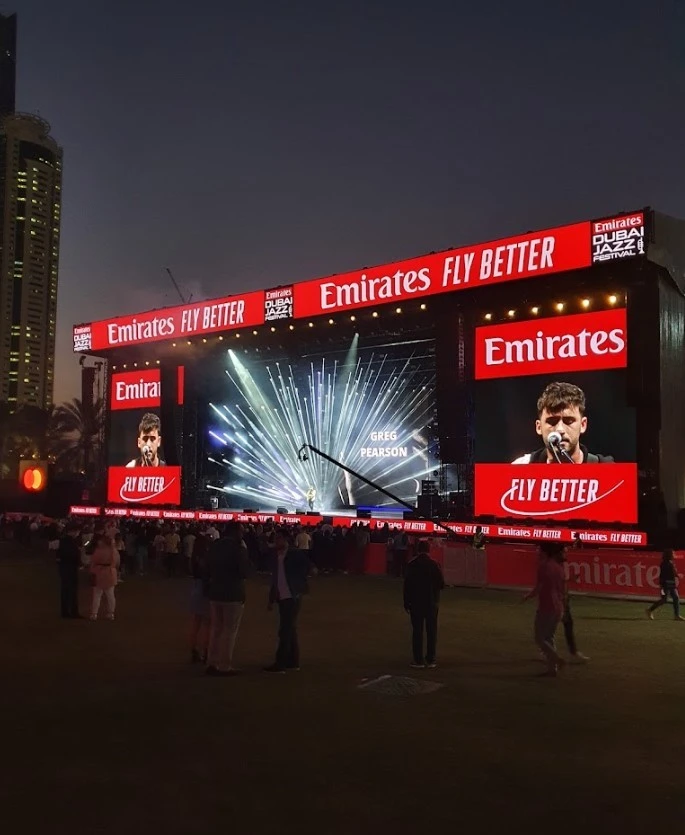 Concert stage at Dubai Media City Amphitheatre, evening event.
