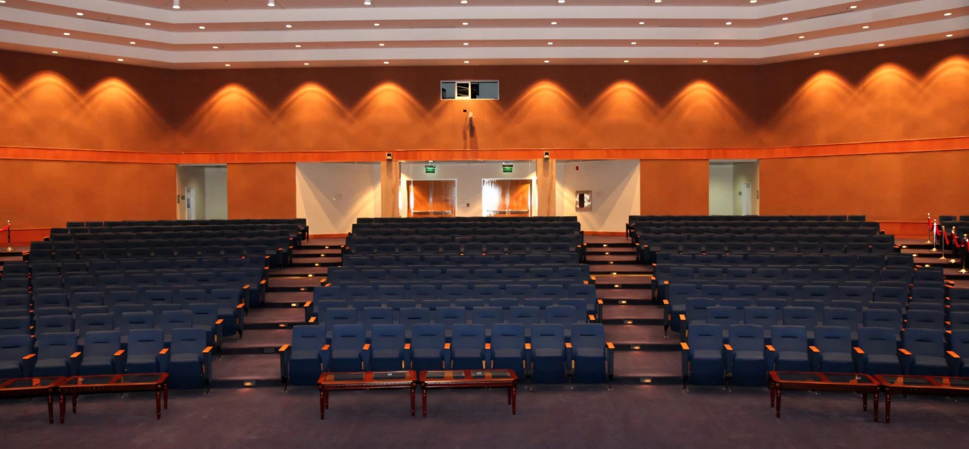 Empty auditorium with blue seats, Hct Dubai Al-Nahda Campus.