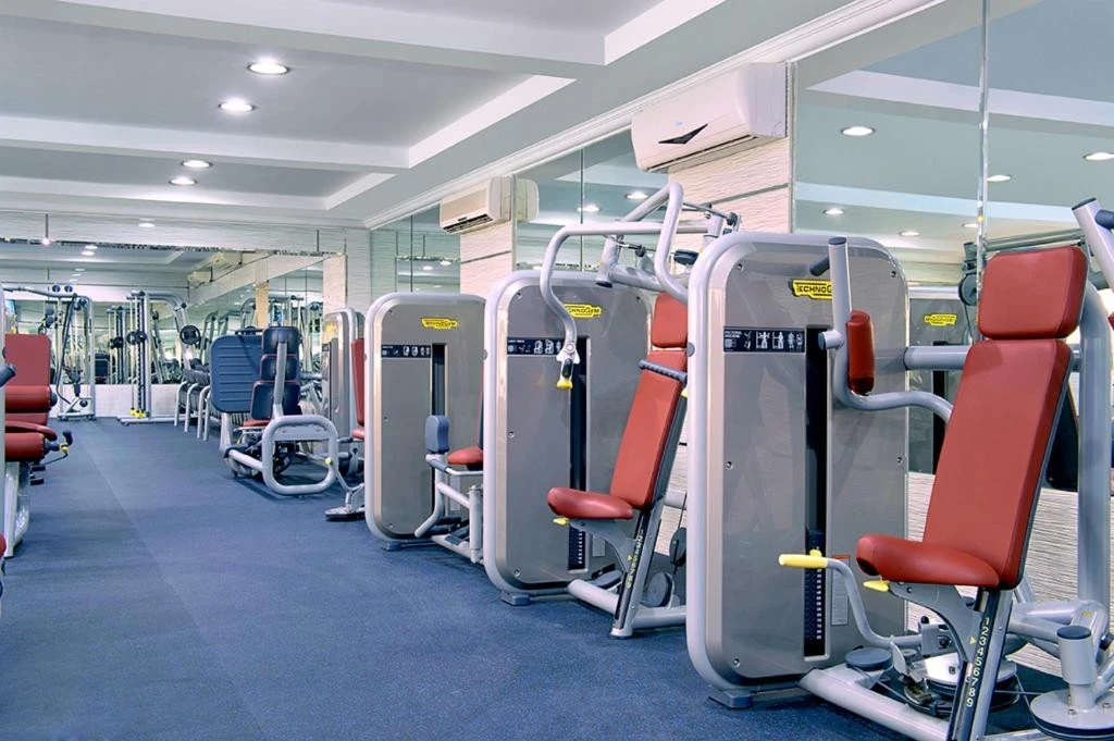 Modern gym with equipment at All Seasons Hotel Al Ain.