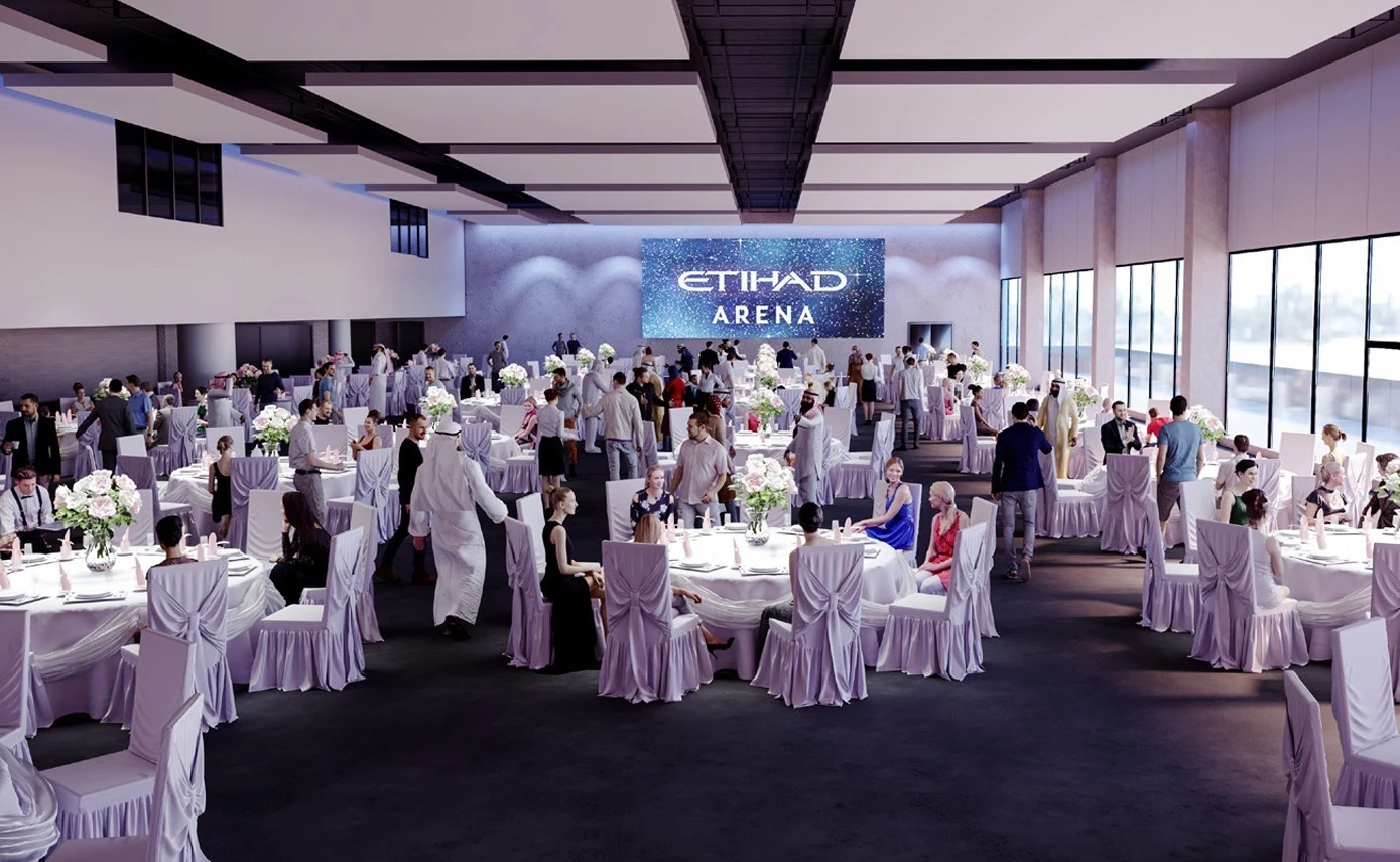 Elegant event at Etihad Arena, Abu Dhabi, with seated guests.