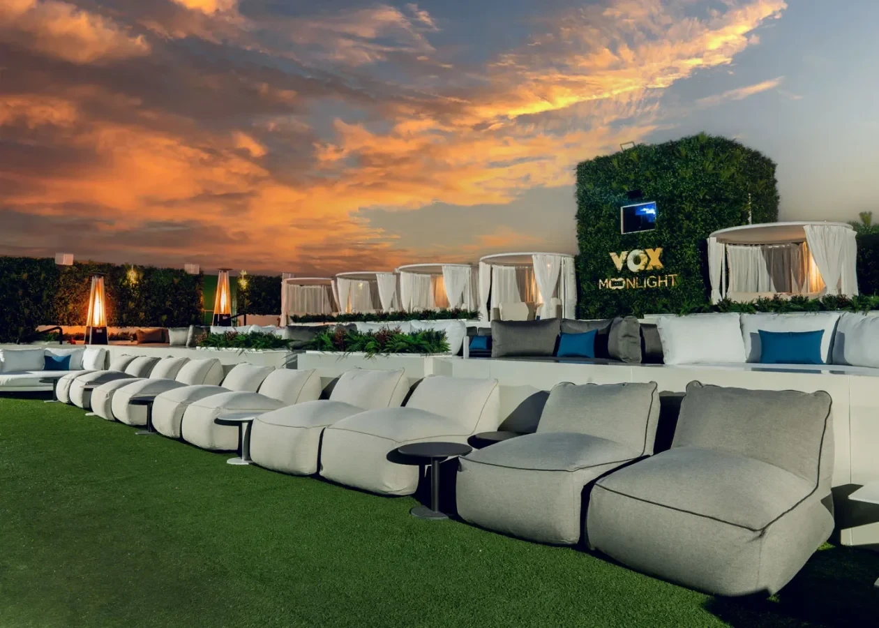 Outdoor seating at VOX Moonlight, Dubai during sunset.