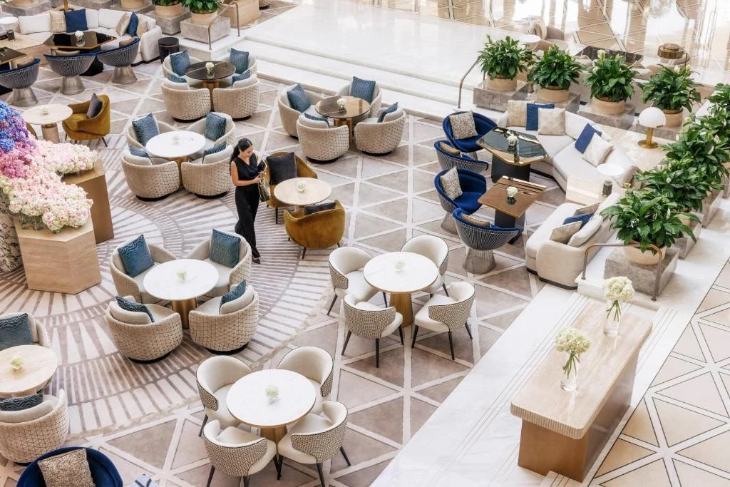 Luxurious lounge area at Jumeirah Emirates Towers, Dubai, with elegant seating.