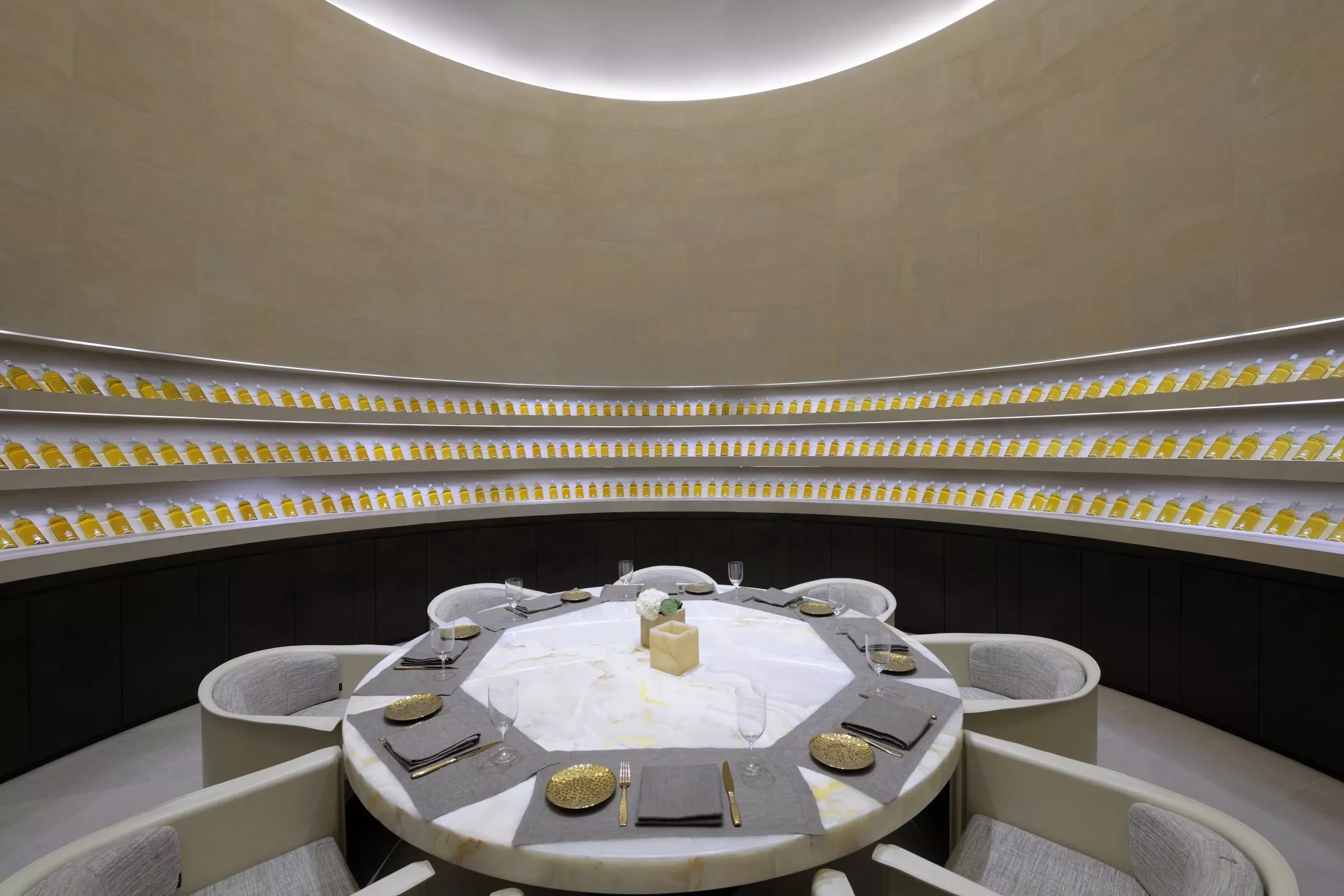 Elegant dining area, Armani Hotel Dubai, circular table, luxurious setting.