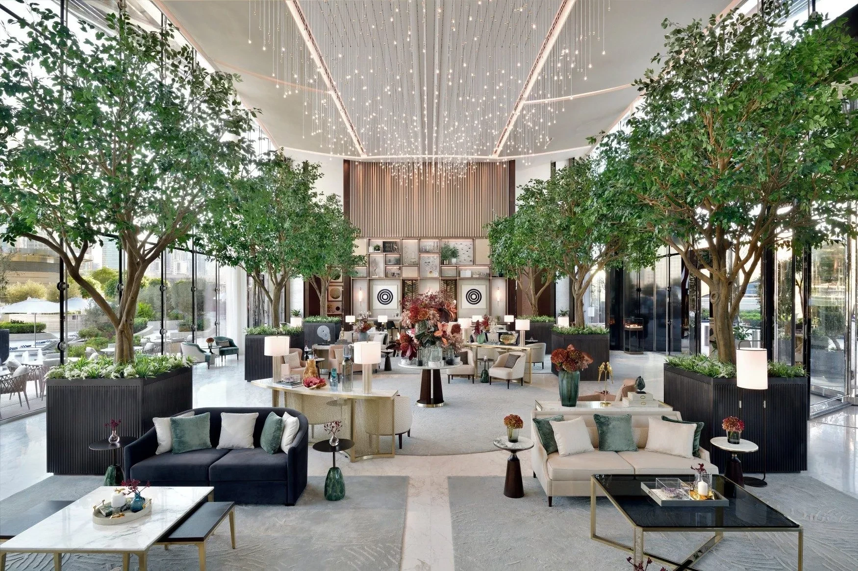 Elegant Address Sky View hotel lobby with lush greenery, Dubai.