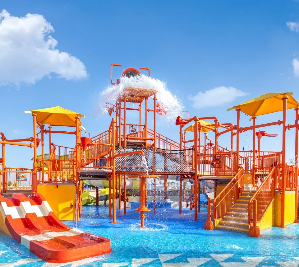 Colorful water park at JA Beach Hotel, Dubai, under blue sky.