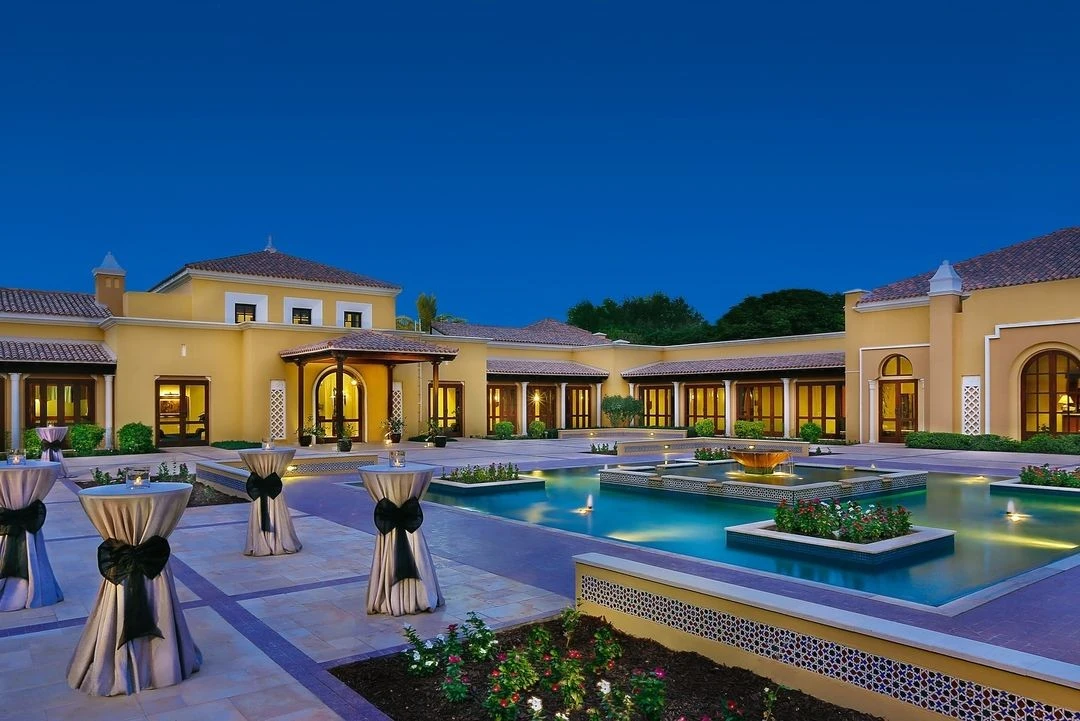 Elegant courtyard at Dubai Polo & Equestrian Club, evening setting.