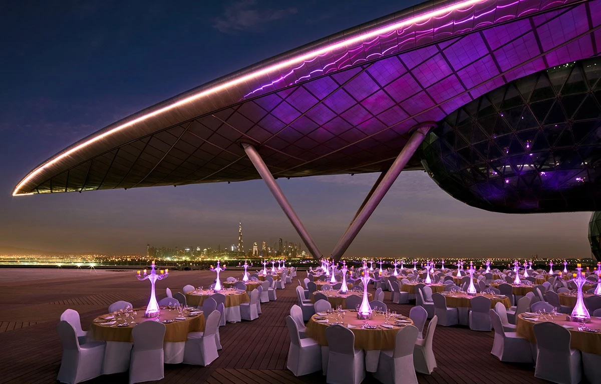 Elegant outdoor event setup at The Meydan Hotel, Dubai.