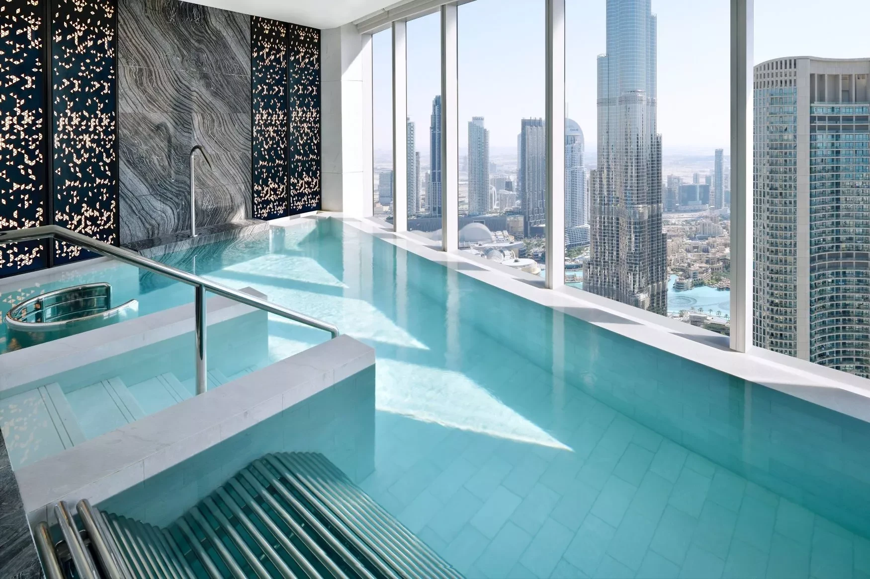 Infinity pool with city skyline view at Address Sky View, Dubai.