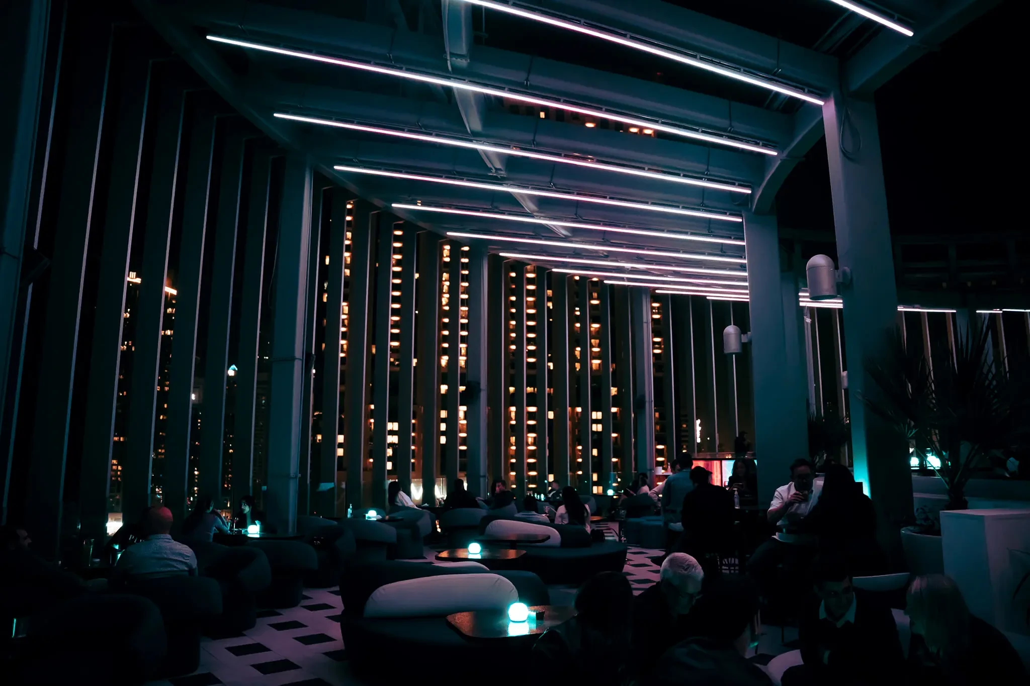 Atelier M rooftop lounge with city view, Dubai nightlife ambiance.